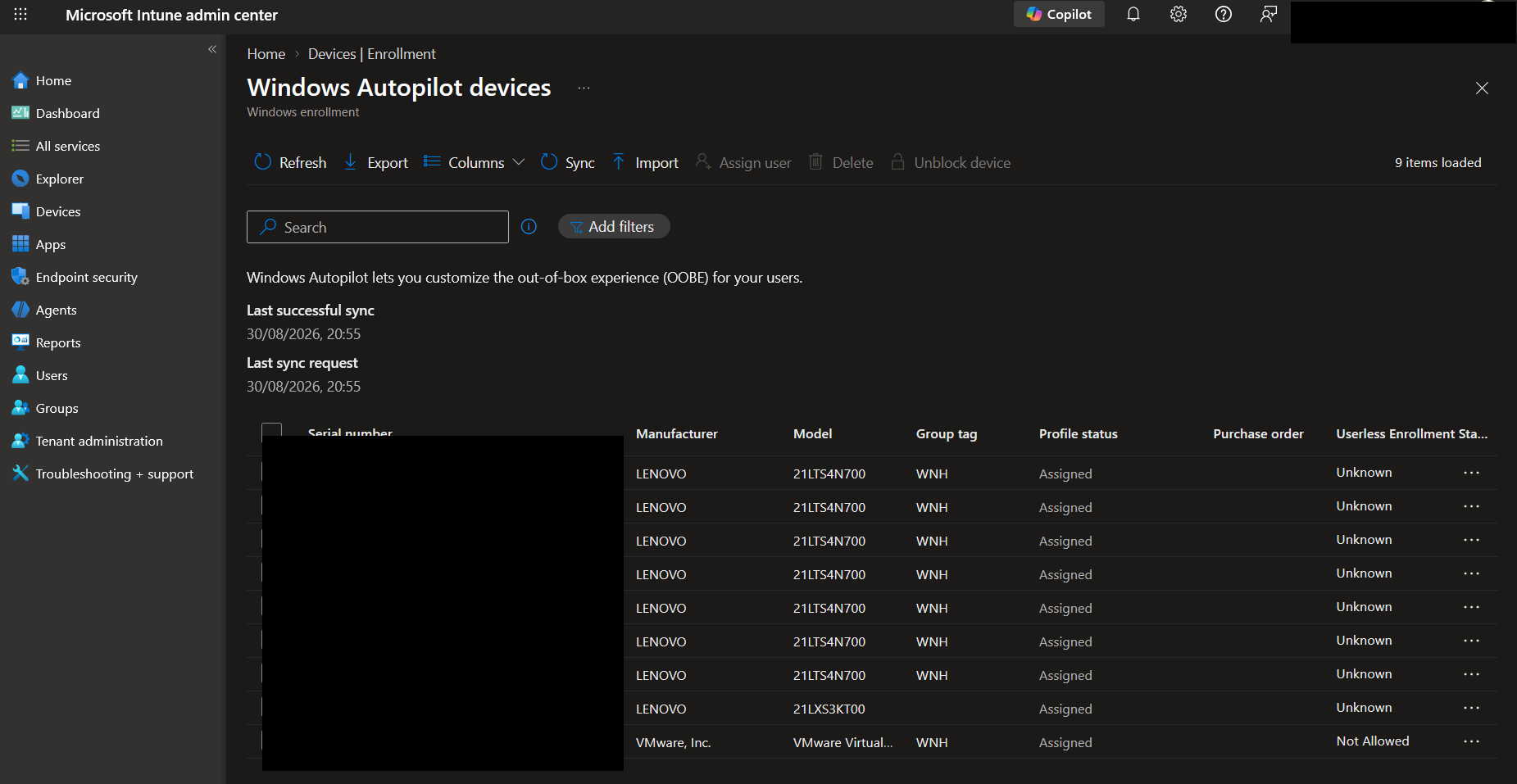 Microsoft Intune admin centre, Devices, Enrollment, Windows Autopilot devices list, with serial numbers and tenant identity redacted